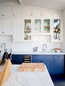 A classic design style kitchen with blue cupboards